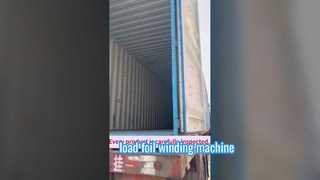 Loading foil winding machine into a container